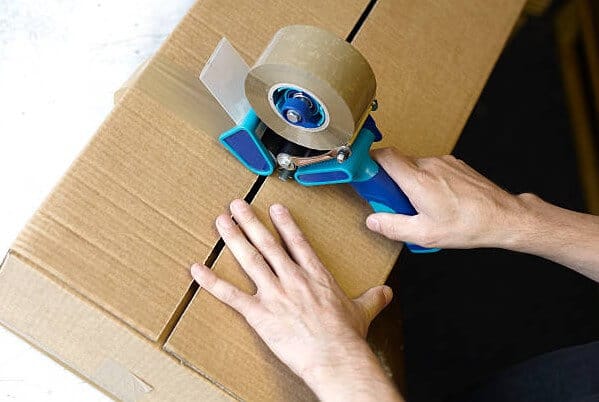 A man is using Packing Dispenser