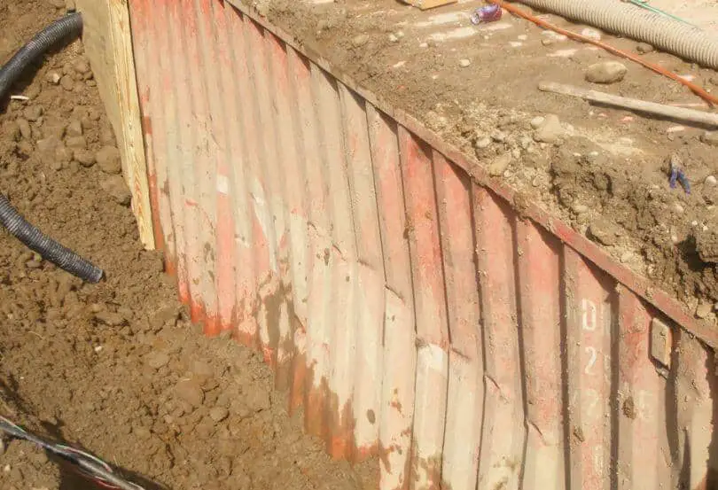 Shipping container buried in the ground