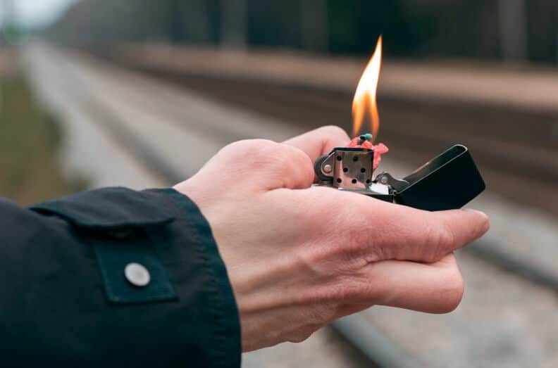 A man holding a lighter