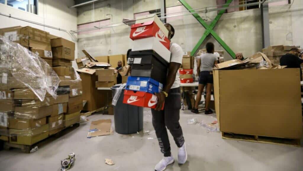 Man carrying bunch of boxes