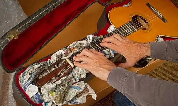 Man is operating a guitar
