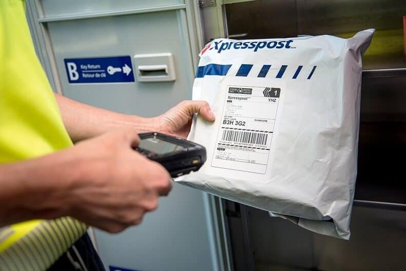 A man scanning a XPress post package