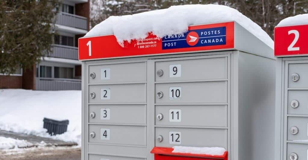 Two mailboxes around lots of snow ranging from 1 to 12